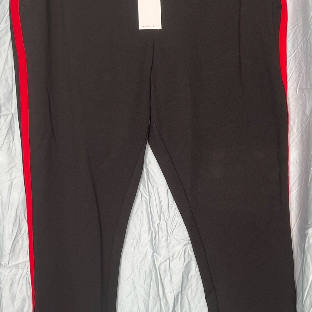 Universal Standard Black Skinny Ponte Pants with Red Stripes.